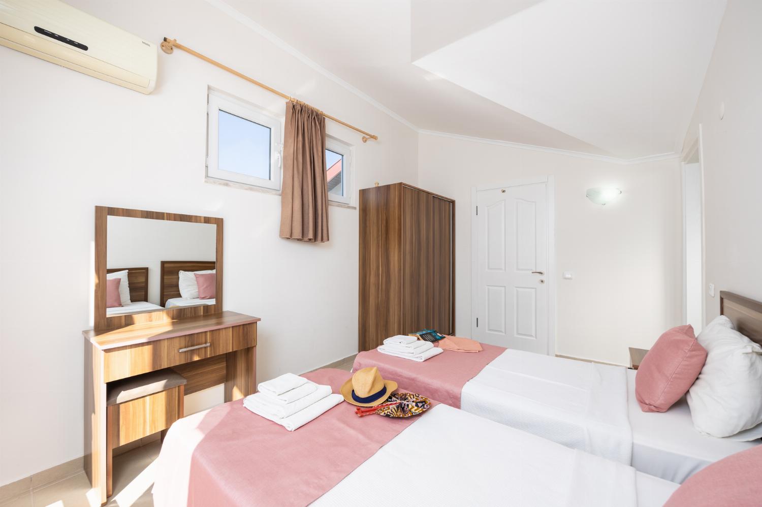 Twin bedroom with en suite bathroom and A/C