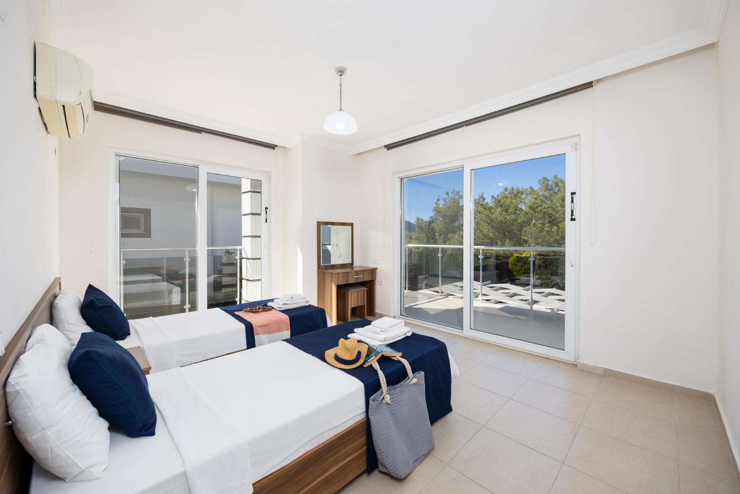 Twin bedroom with en suite bathroom and A/C