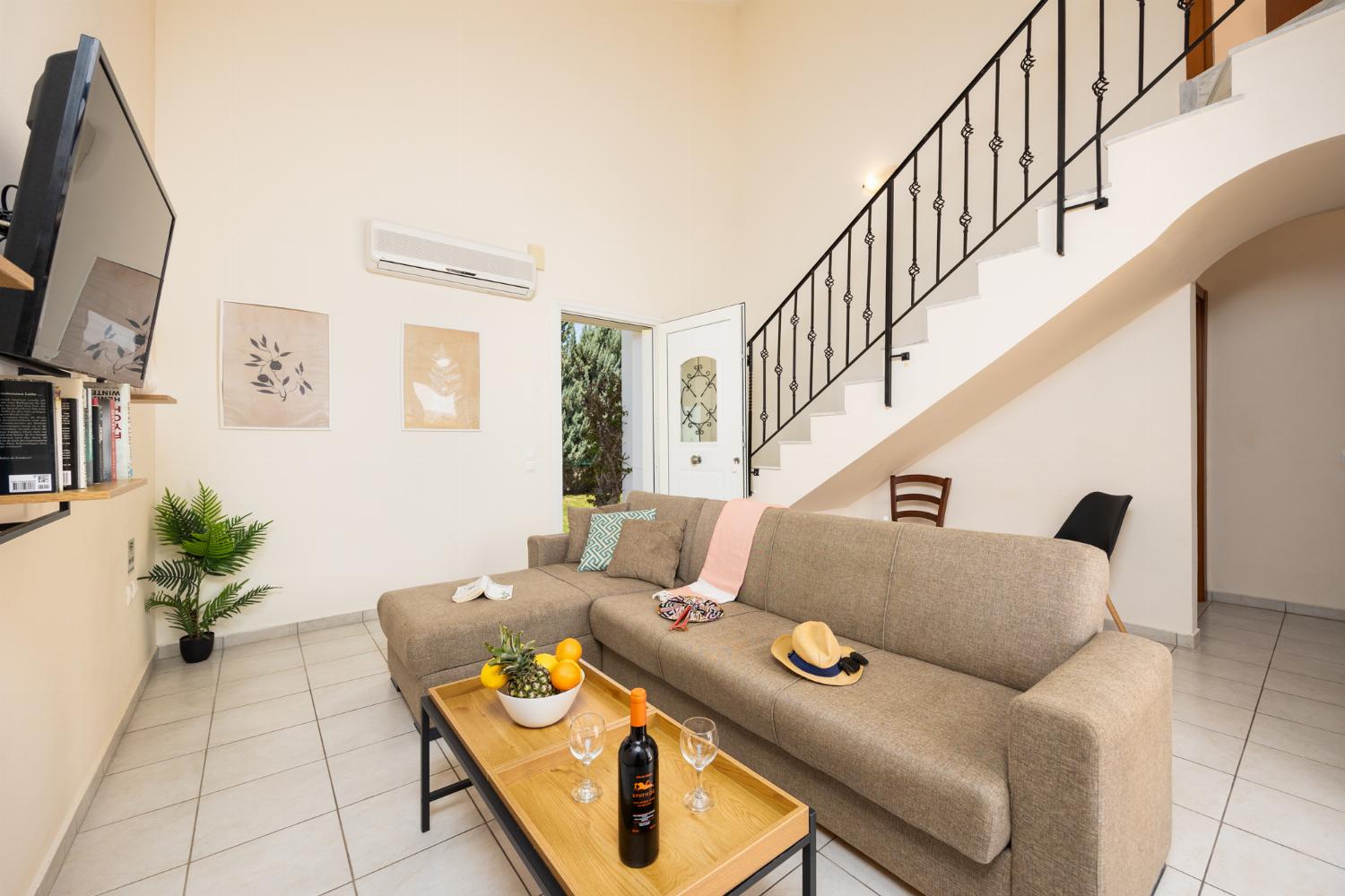 Living room with sofa, A/C, WiFi internet, and satellite TV