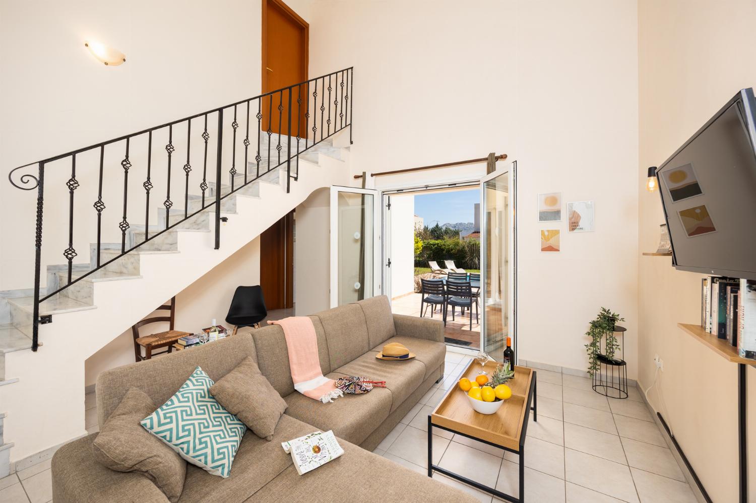 Living room with sofa, A/C, WiFi internet, and satellite TV