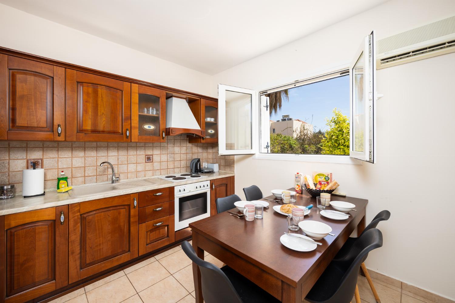 Equipped kitchen with dining area and A/C