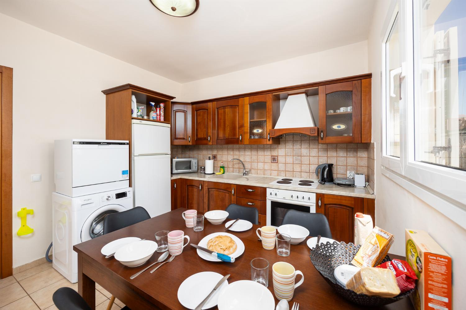 Equipped kitchen with dining area and A/C