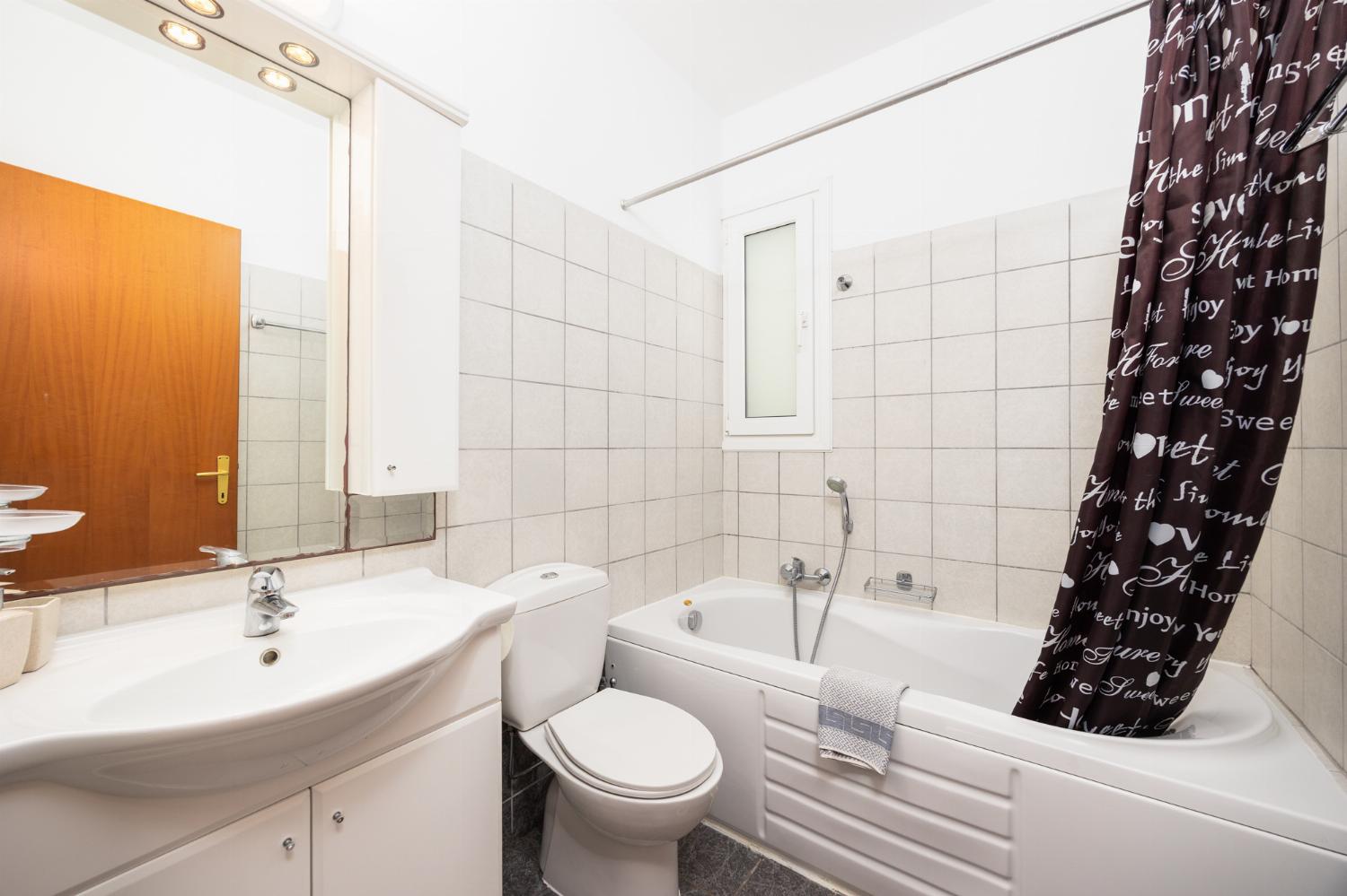 Family bathroom with bath and shower
