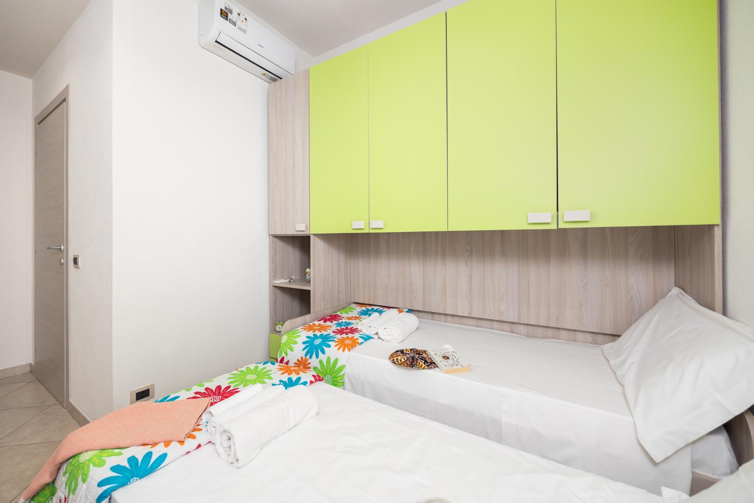 Twin bedroom with en suite bathroom and A/C