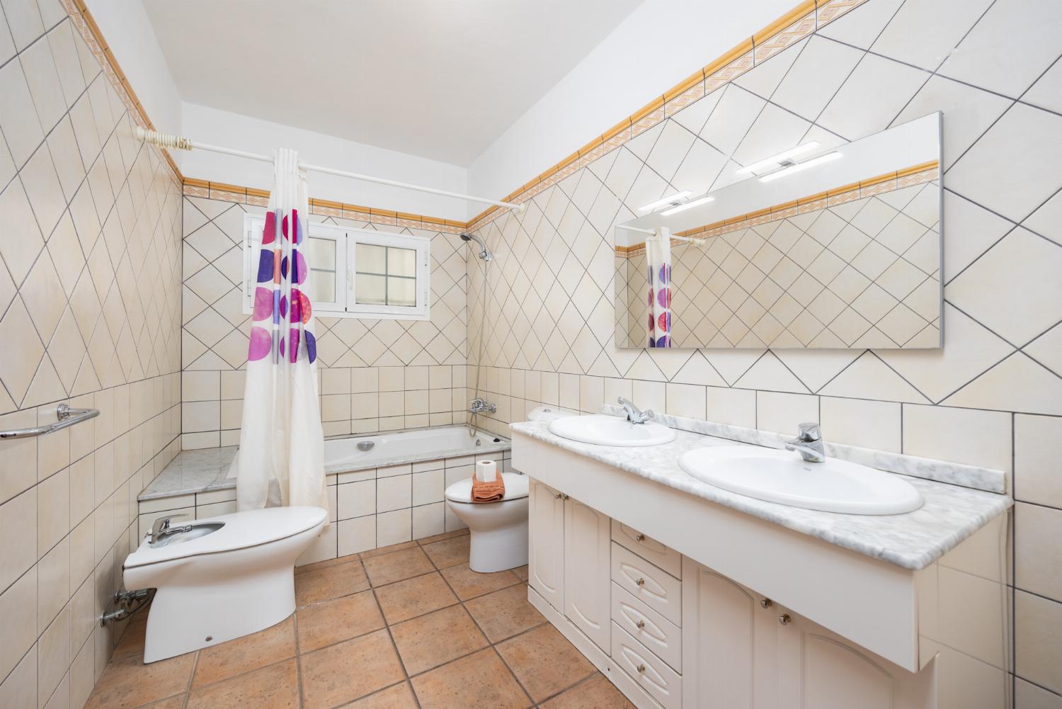 Family bathroom with bath and shower