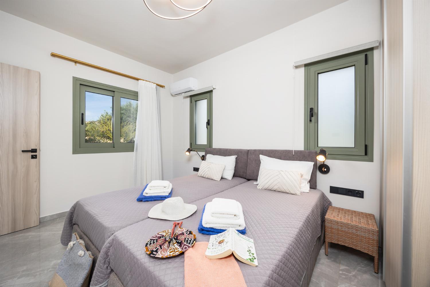 Twin bedroom with en suite bathroom and A/C