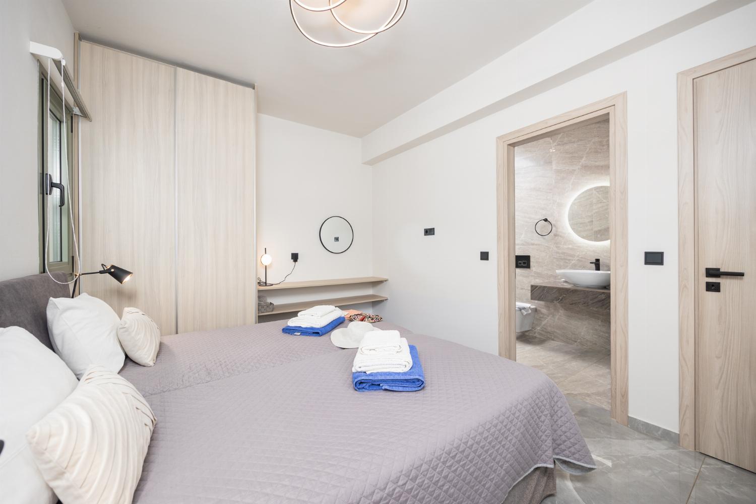 Twin bedroom with en suite bathroom and A/C