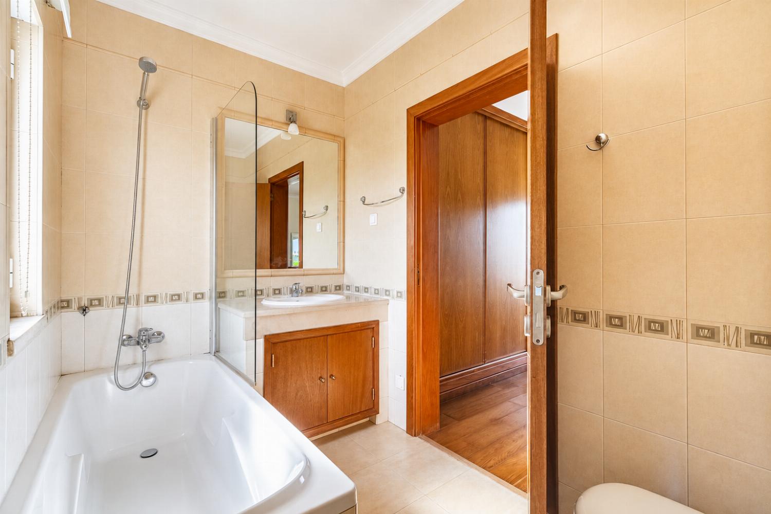En suite bathroom with bath