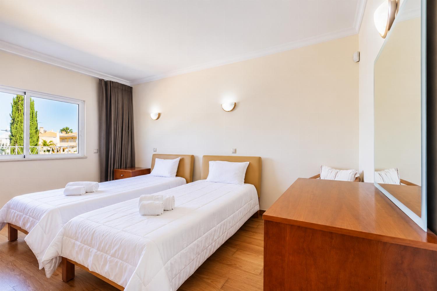 Twin bedroom with en suite bathroom and A/C