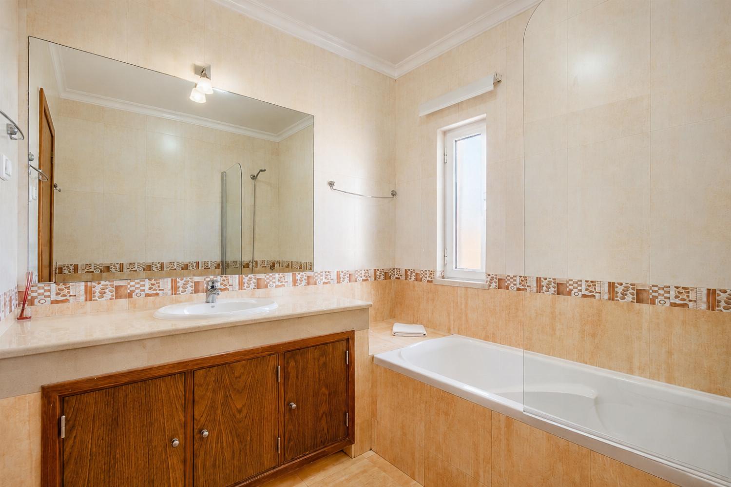 En suite bathroom with bath