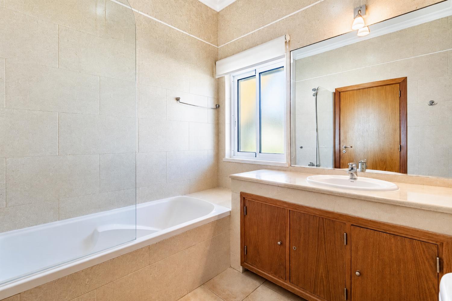 En suite bathroom with bath