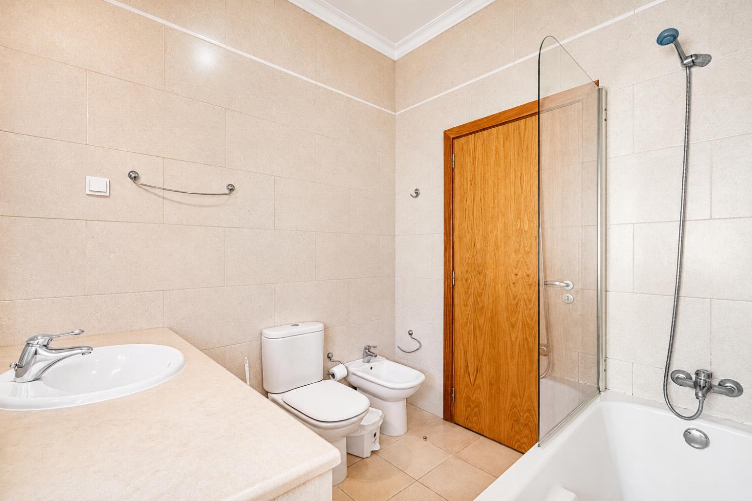 En suite bathroom with bath