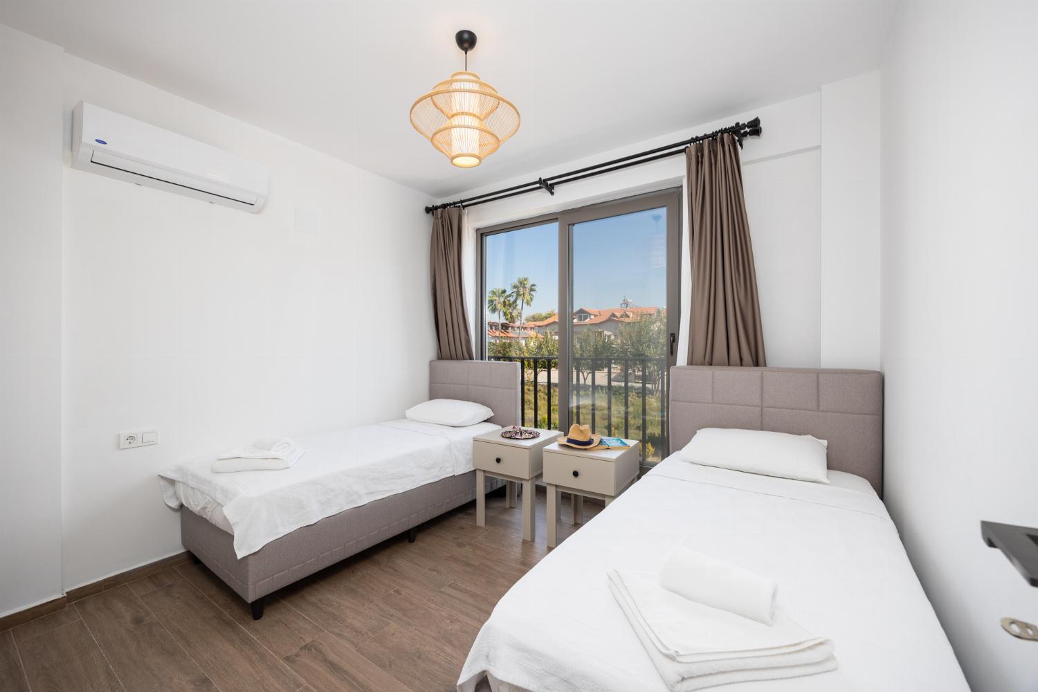 Twin bedroom with en suite bathroom and A/C