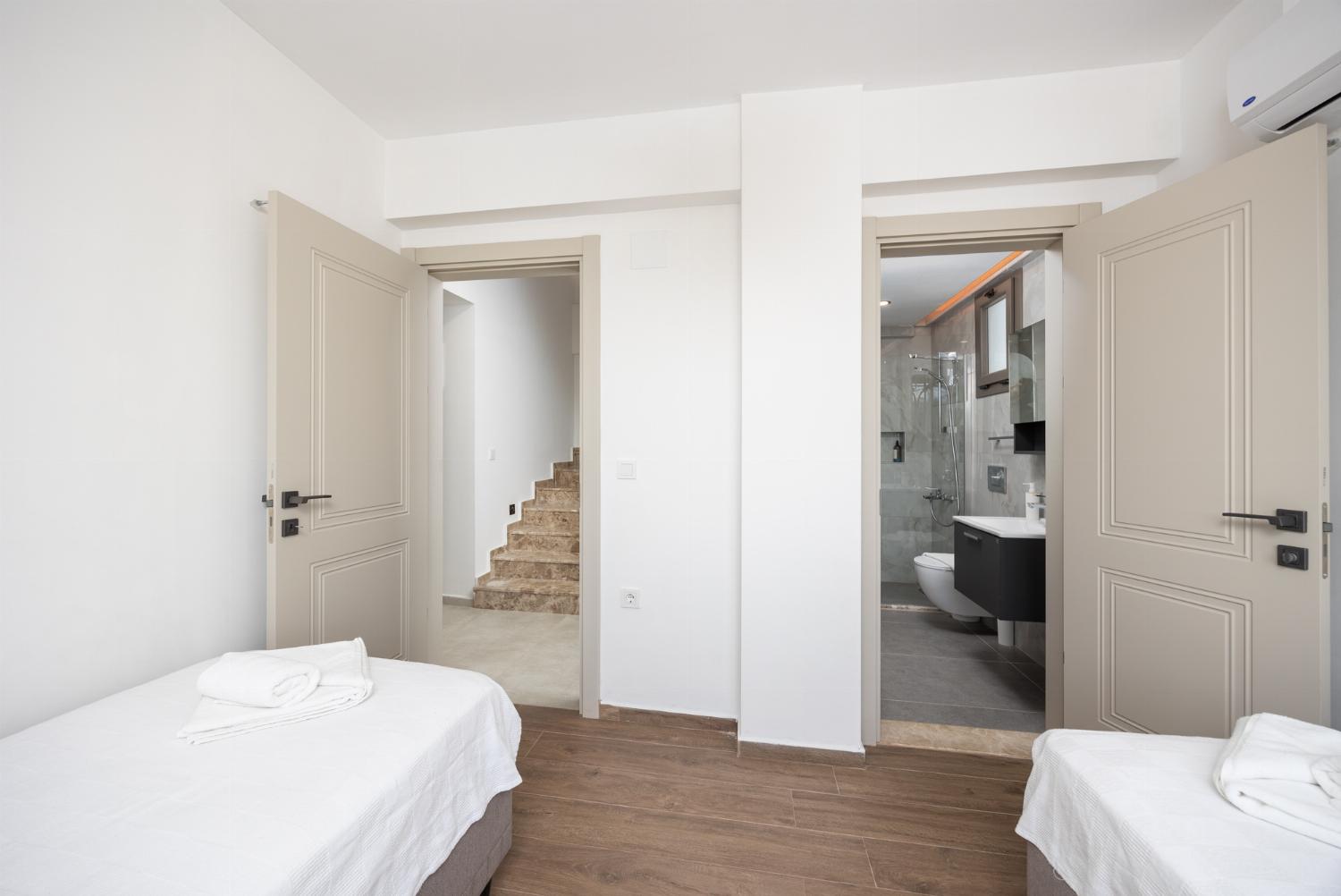 Twin bedroom with en suite bathroom and A/C