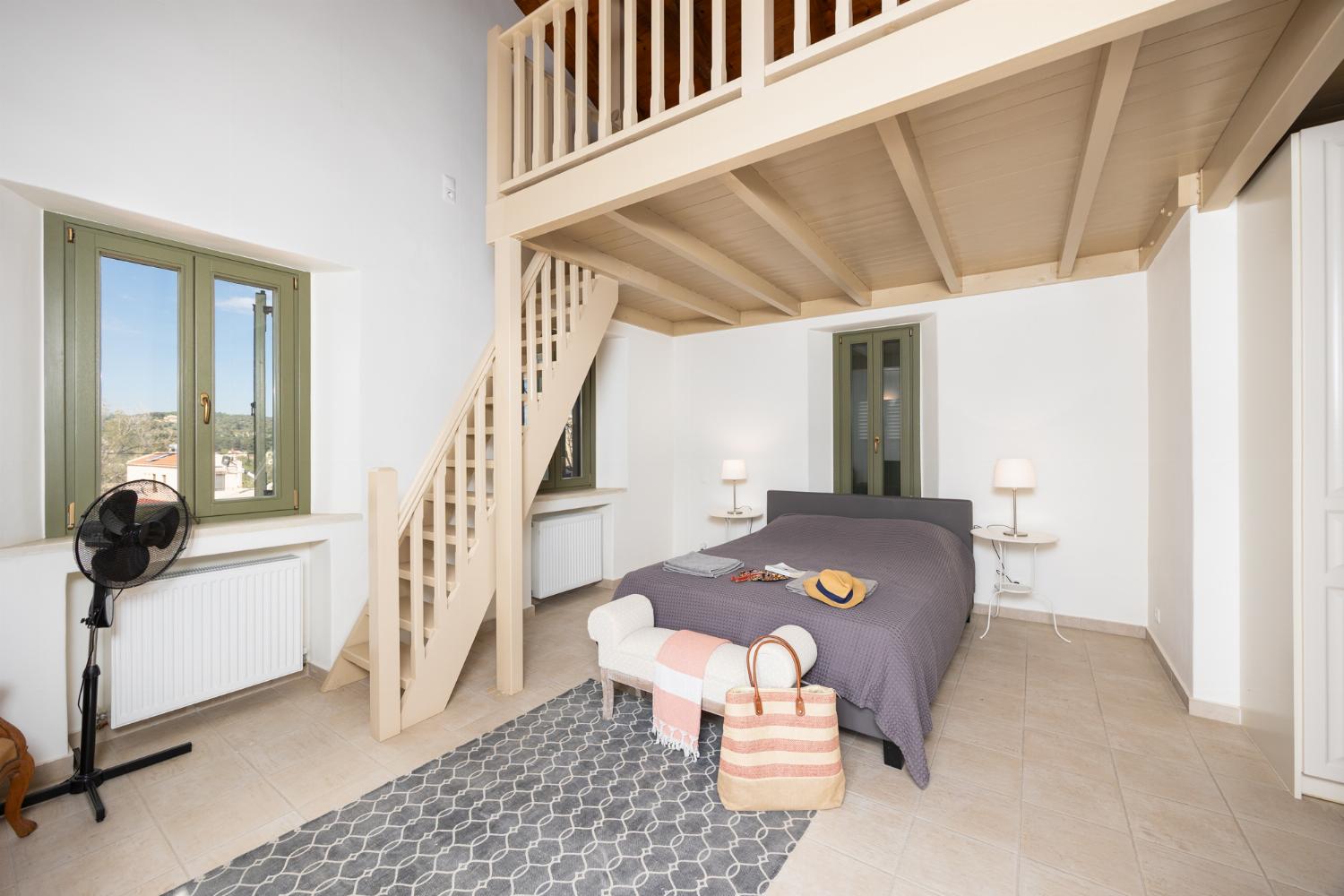 Main building: Bedroom with mezzanine, double bed, sofa-bed, en suite bathroom, and A/C
