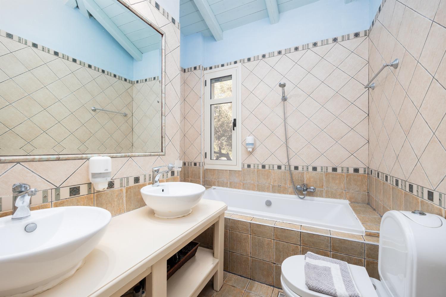 Family bathroom with bath and shower