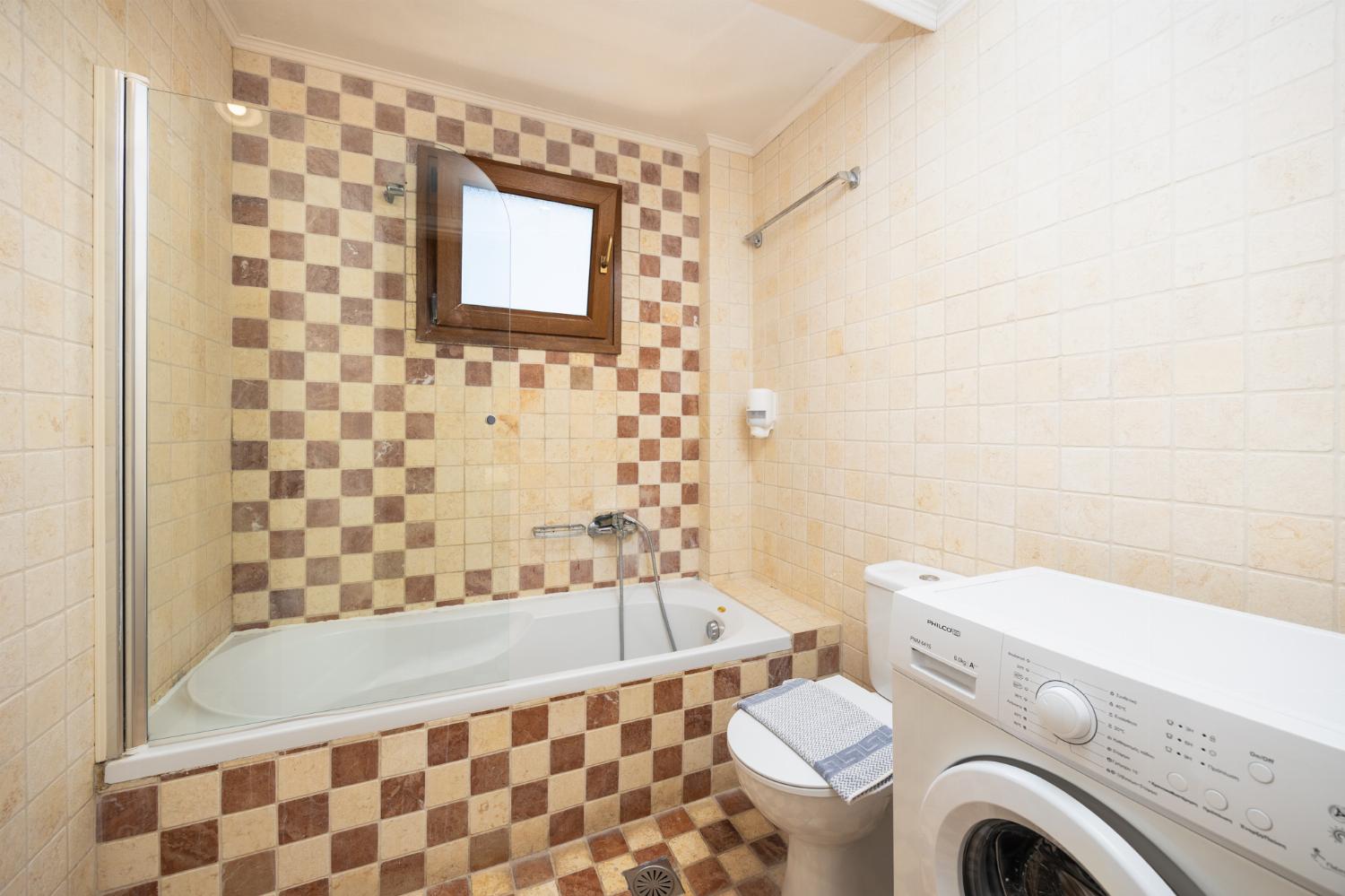 Family bathroom with bath and shower