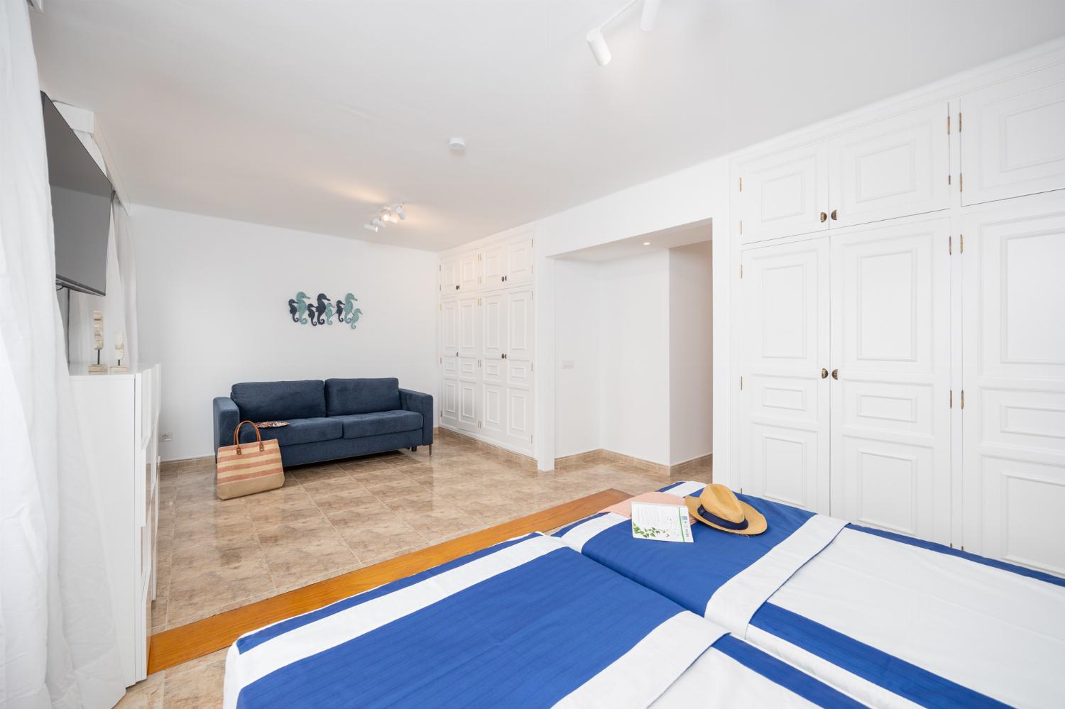 Twin bedroom with en suite bathroom and A/C
