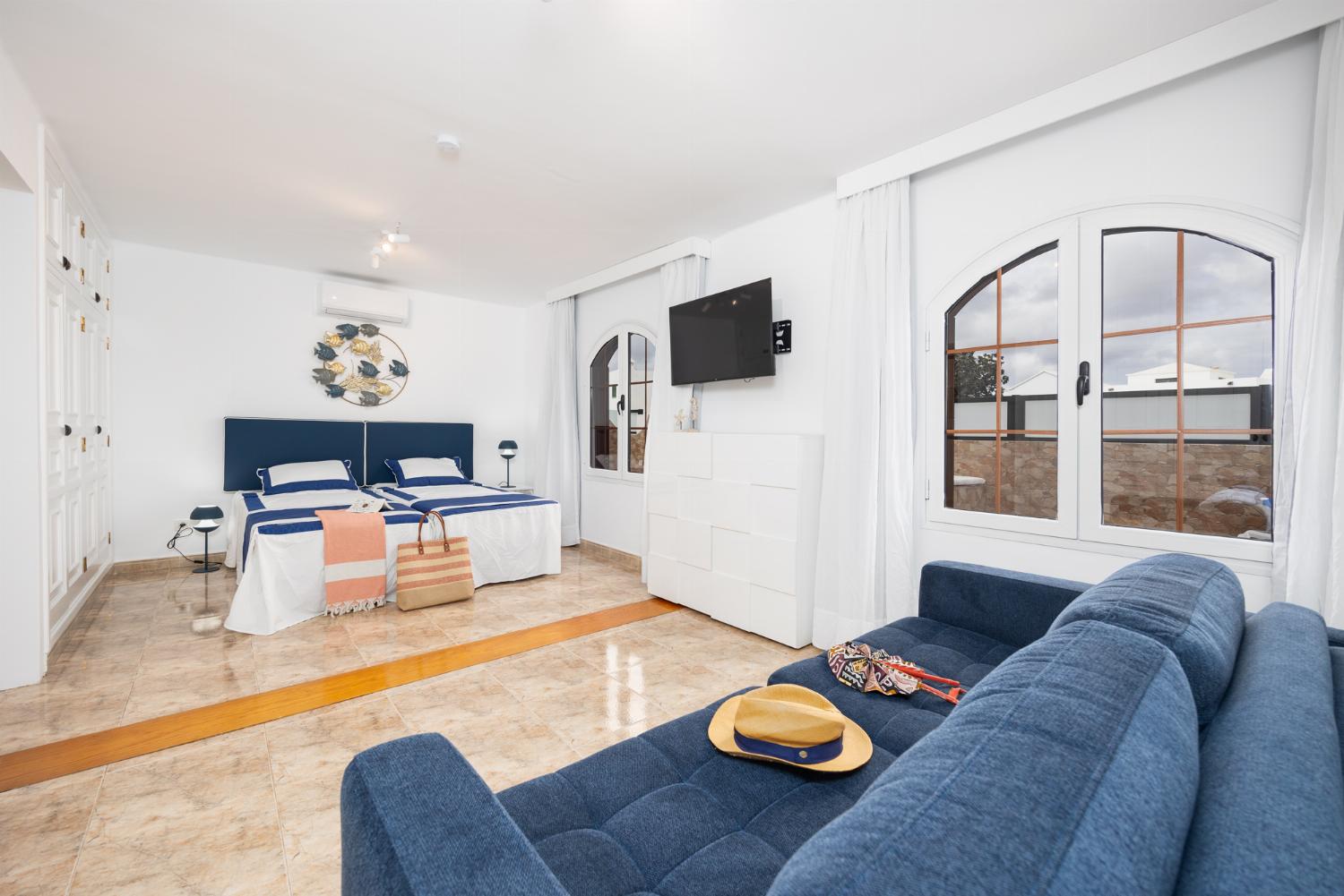 Twin bedroom with en suite bathroom and A/C