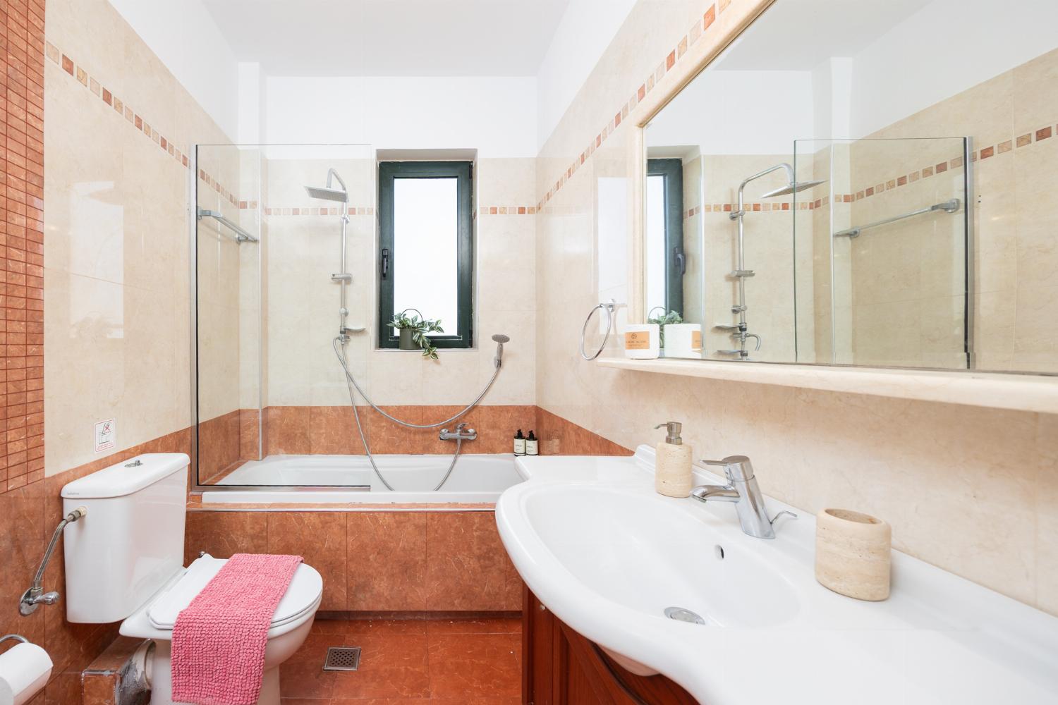 Family bathroom with bath and shower