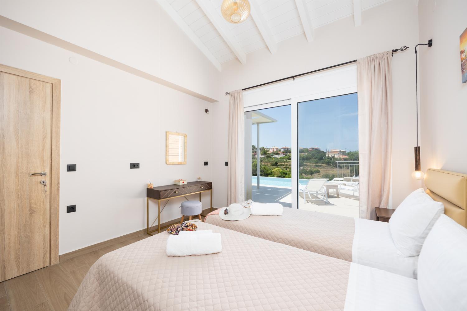 Twin bedroom with en suite bathroom and A/C