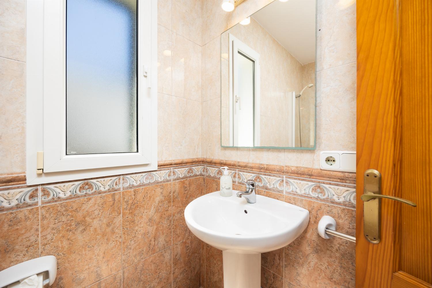 En suite bathroom with bath and shower