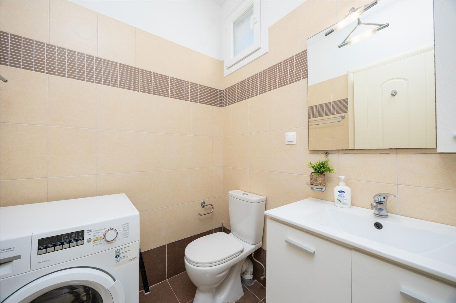 Family bathroom with bath and shower