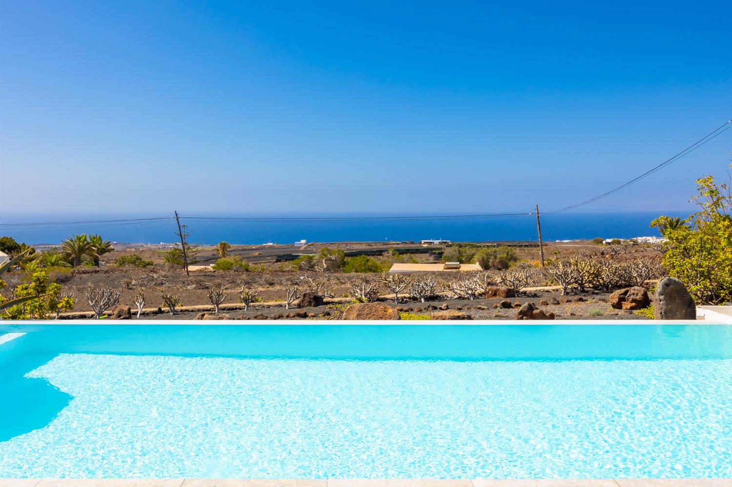 Private pool, terrace, and garden with panoramic sea views