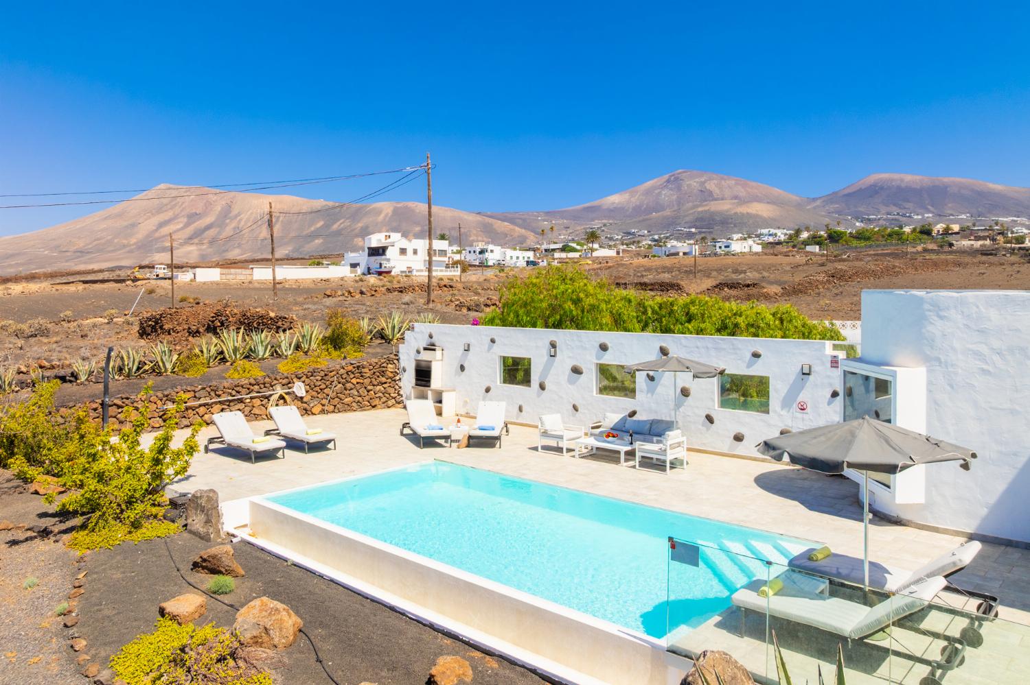 Private pool, terrace, and garden with panoramic sea views