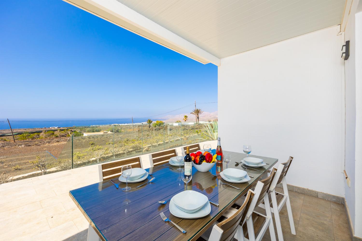 Sheltered terrace area with panoramic sea views