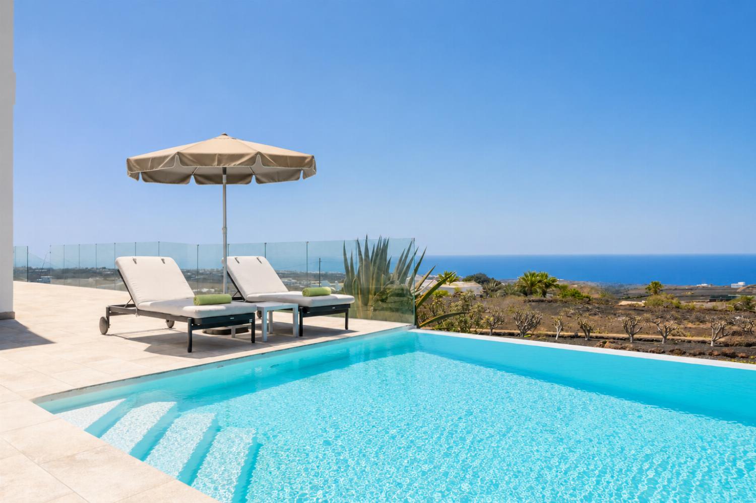 Private pool, terrace, and garden with panoramic sea views