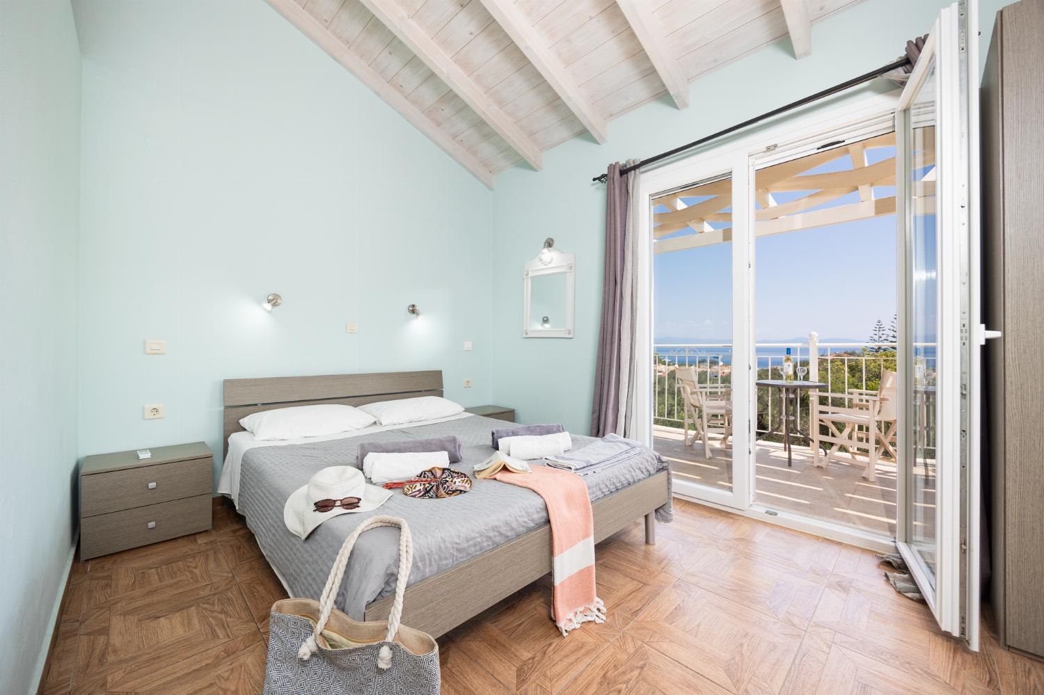 Double bedroom with en suite bathroom, A/C, and sea views