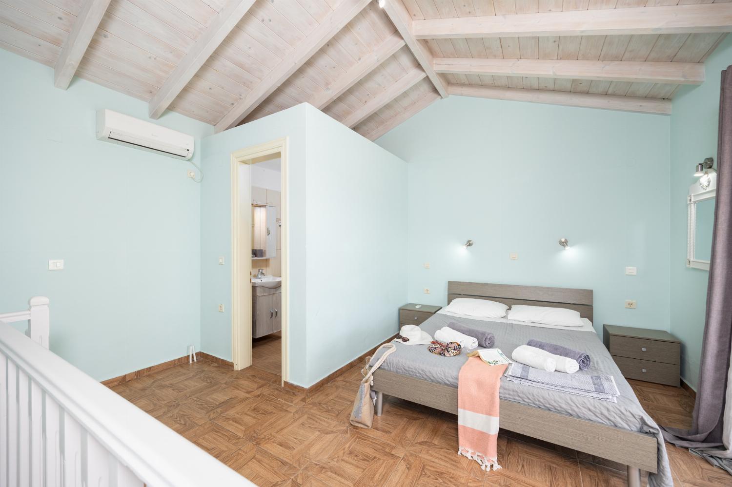 Double bedroom with en suite bathroom, A/C, and sea views