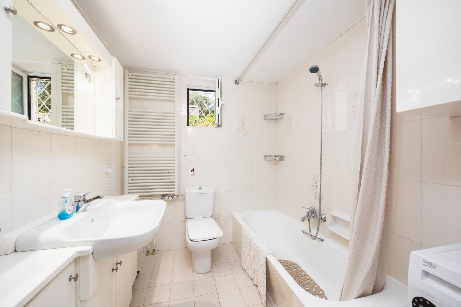 Family bathroom with bath and shower