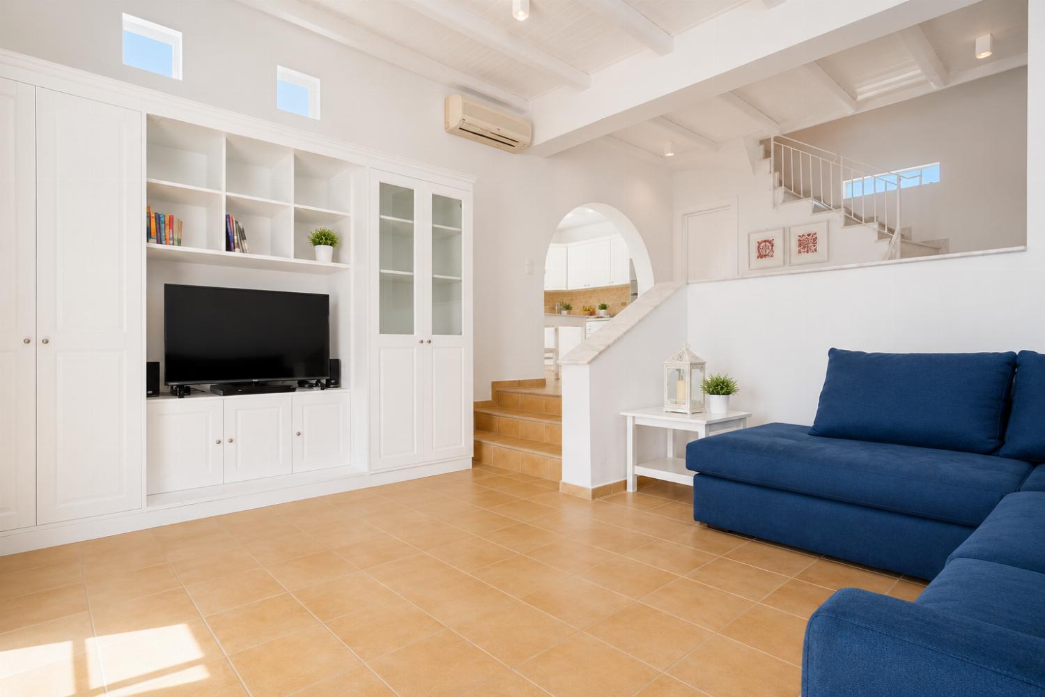 Living room with sofas, A/C, WiFi internet, and satellite TV