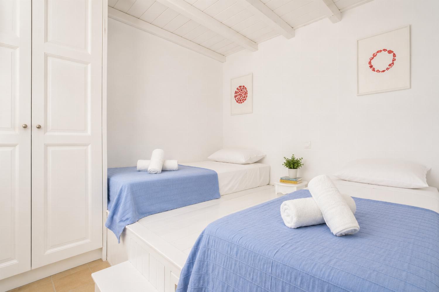 Twin bedroom with en suite bathroom and A/C