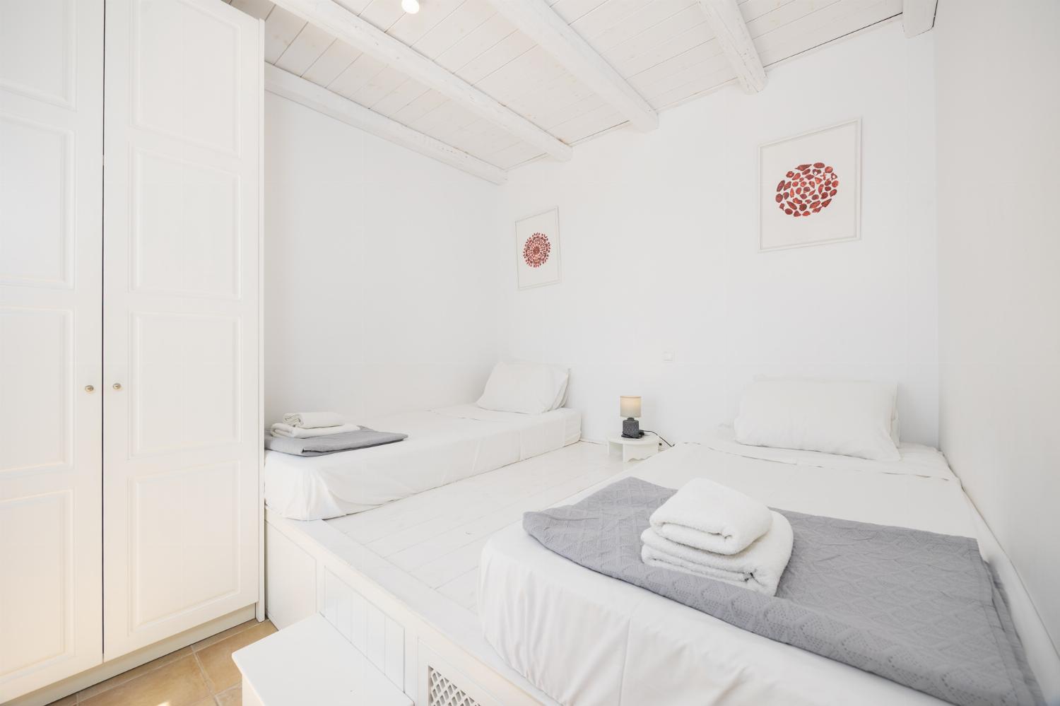 Twin bedroom with en suite bathroom and A/C