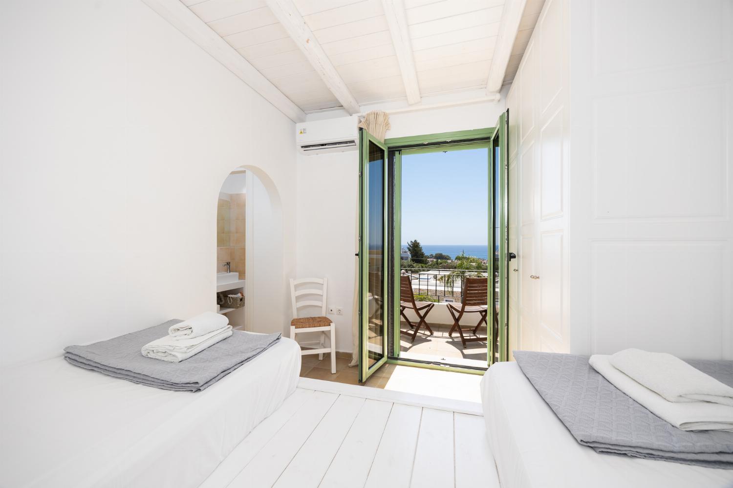 Twin bedroom with en suite bathroom and A/C