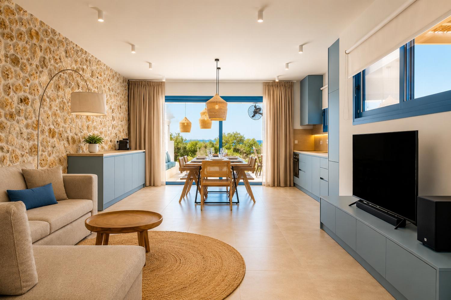 Open-plan living room with sofa, dining area, kitchen, WiFi internet, and satellite TV