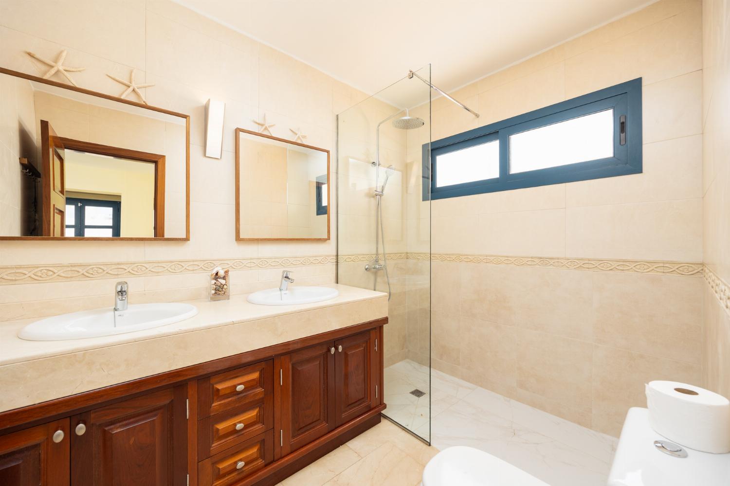 En suite bathroom with shower