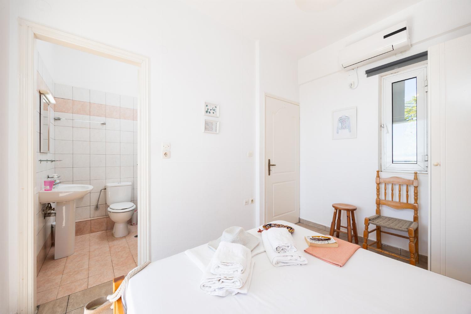 Double bedroom with en suite bathroom, A/C, and sea views