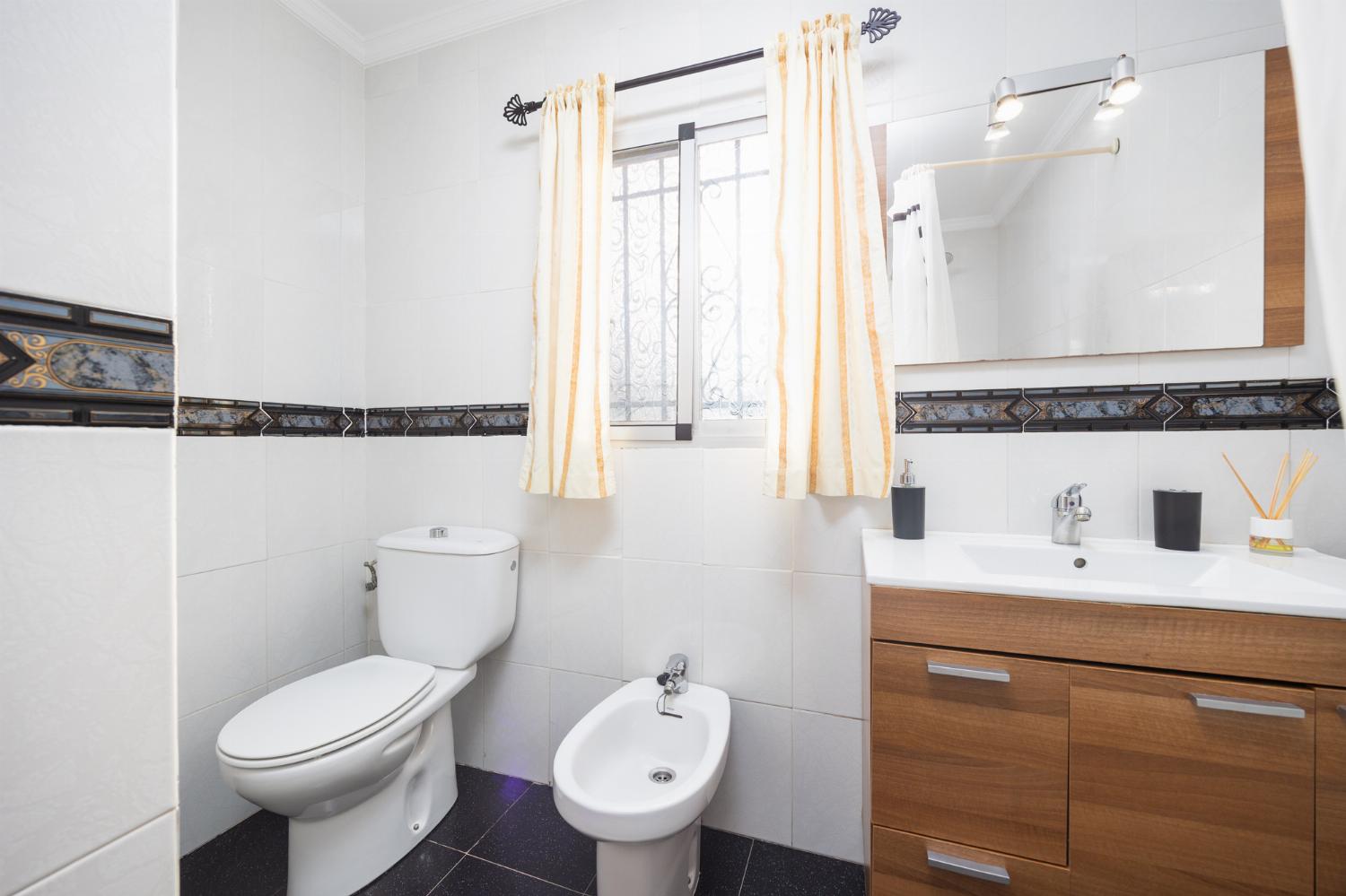 Family bathroom with bath and shower