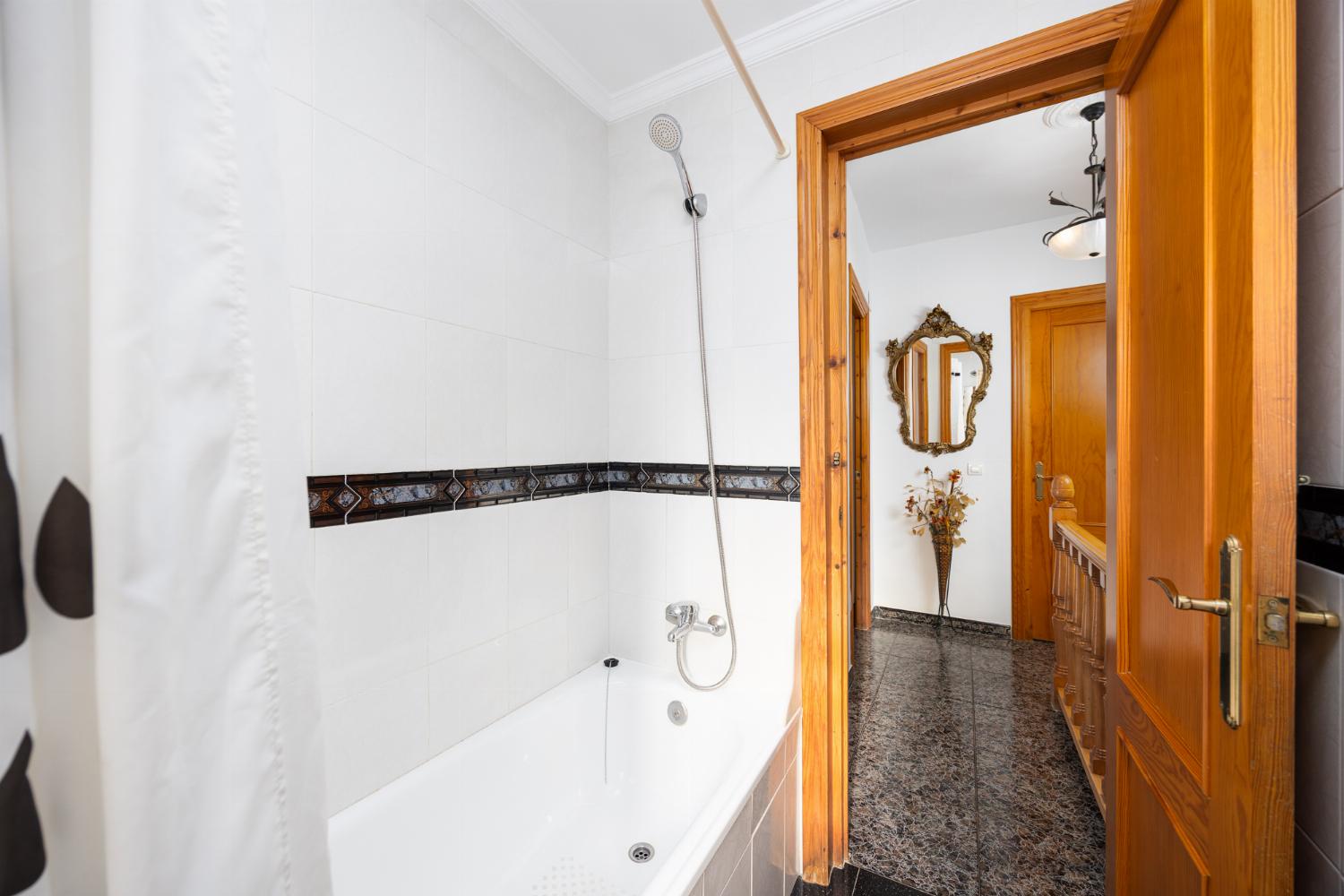 Family bathroom with bath and shower