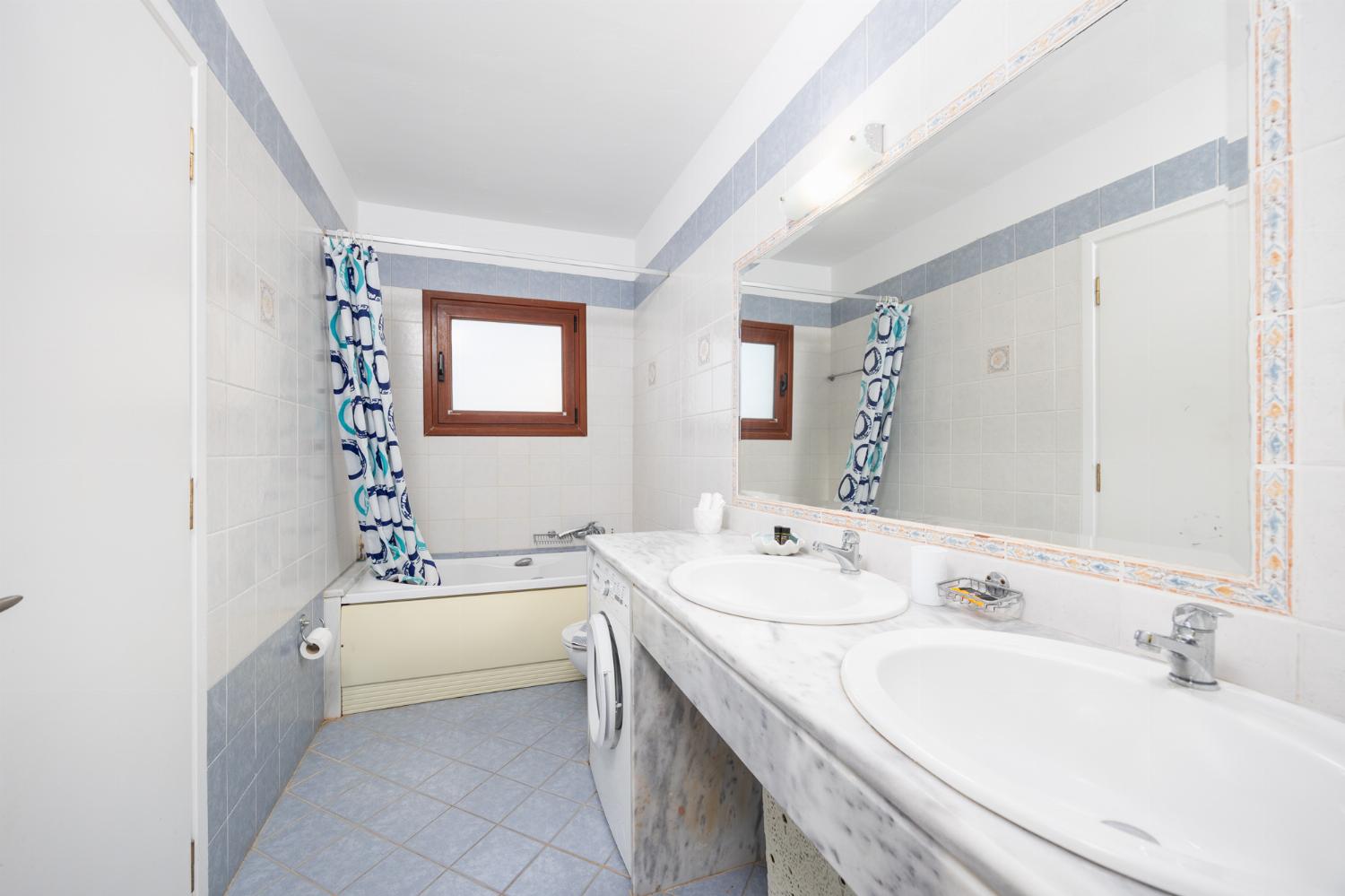 Shared en suite bathroom with bath and shower