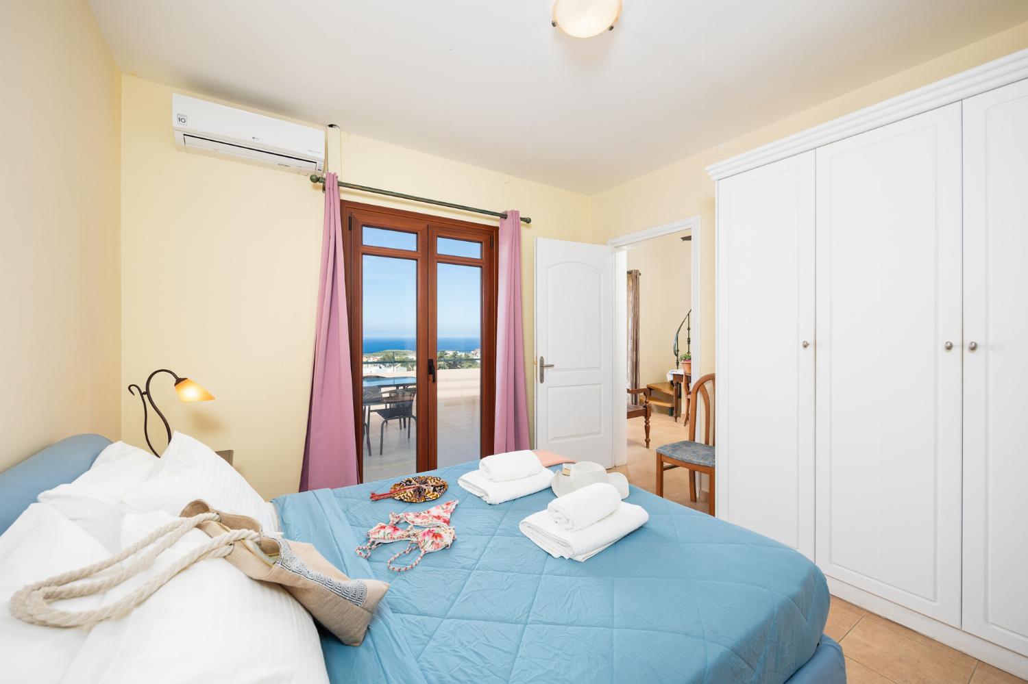 Double bedroom with shared en suite bathroom, A/C, and sea views