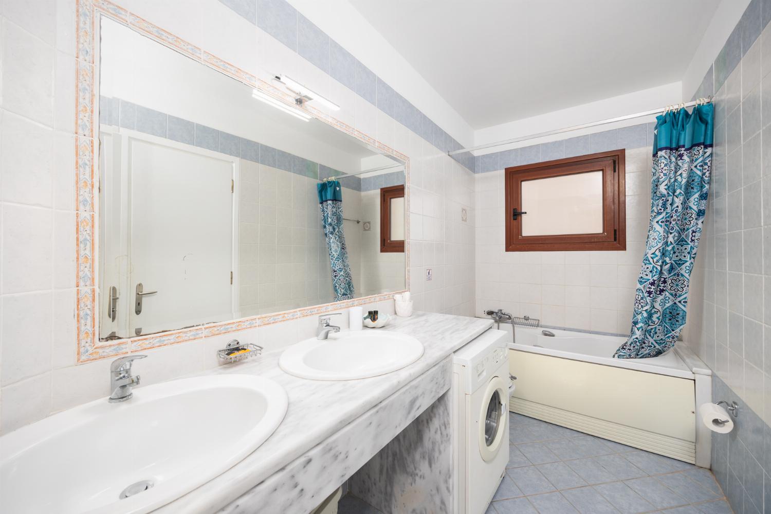 Shared en suite bathroom with bath and shower
