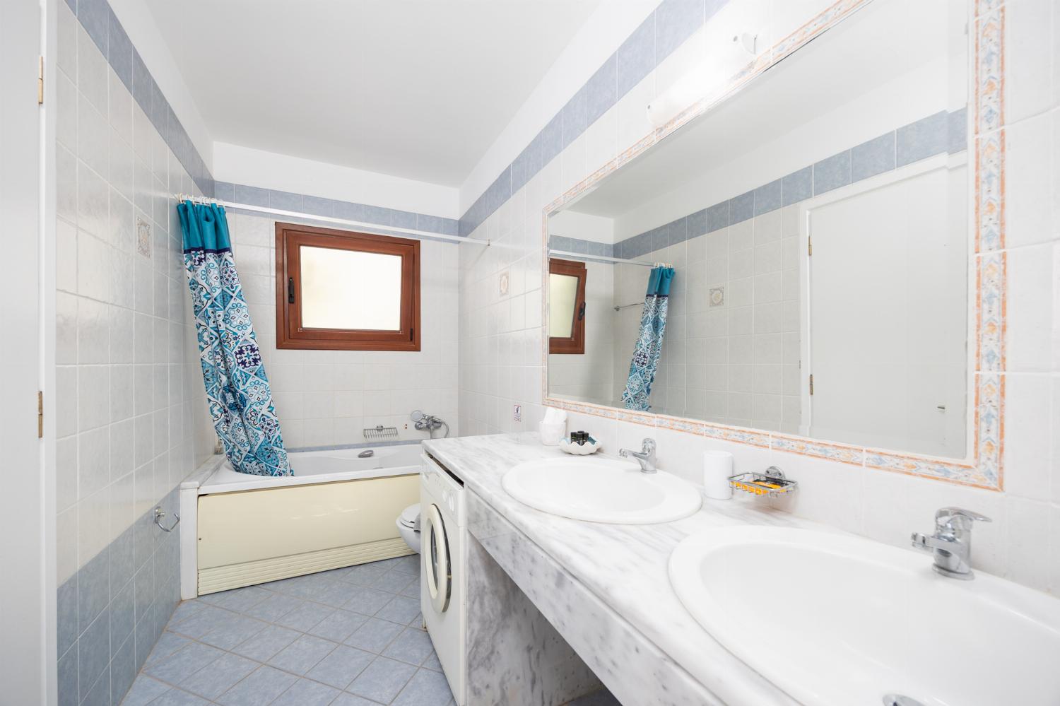 Shared en suite bathroom with bath and shower