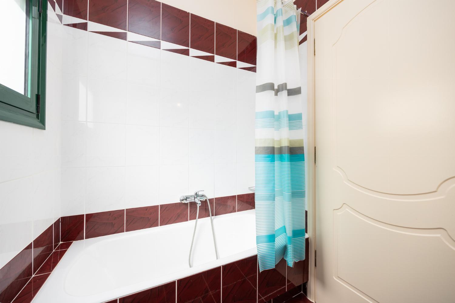 Family bathroom with bath and shower