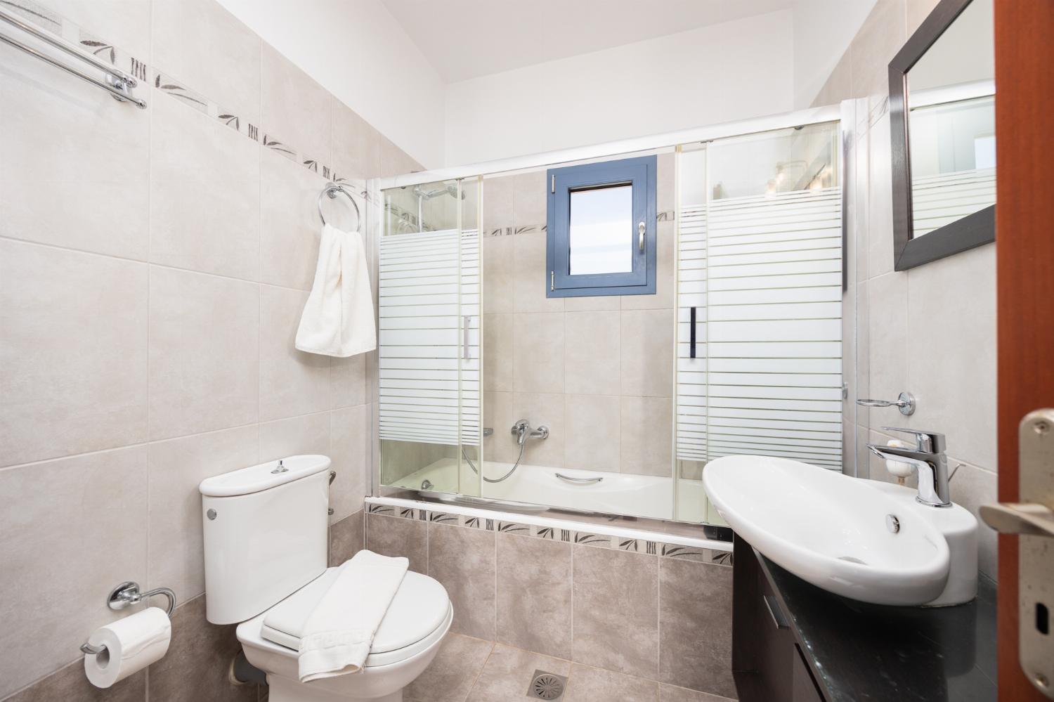 Family bathroom with bath and shower