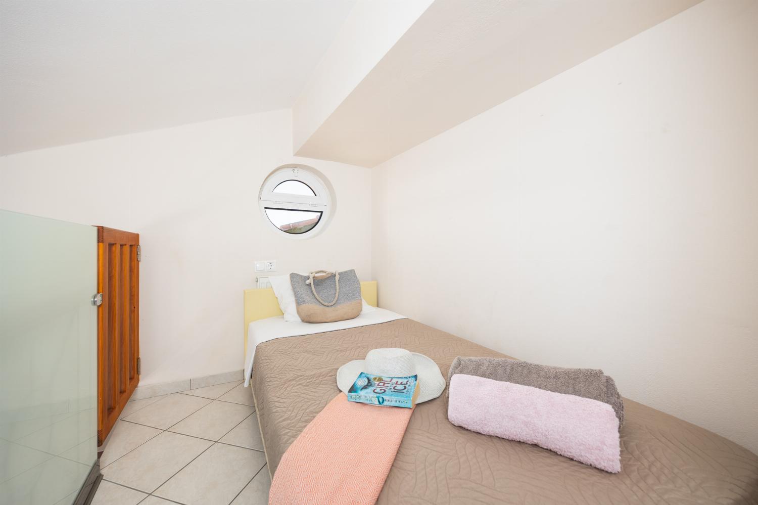 Single bed on mezzanine